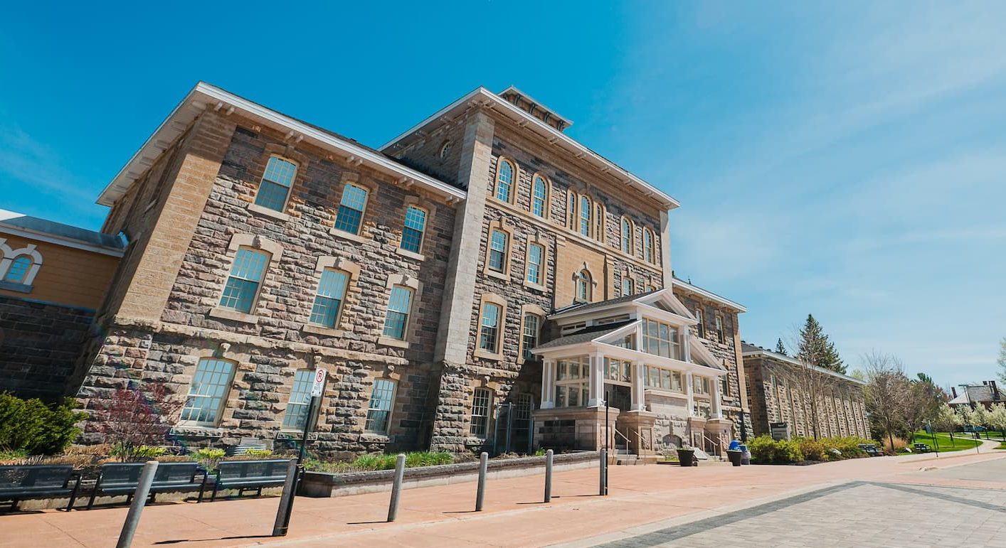 Exterior of the Waypoint administration building, pictured at an angle from the left side of the building entrance.
