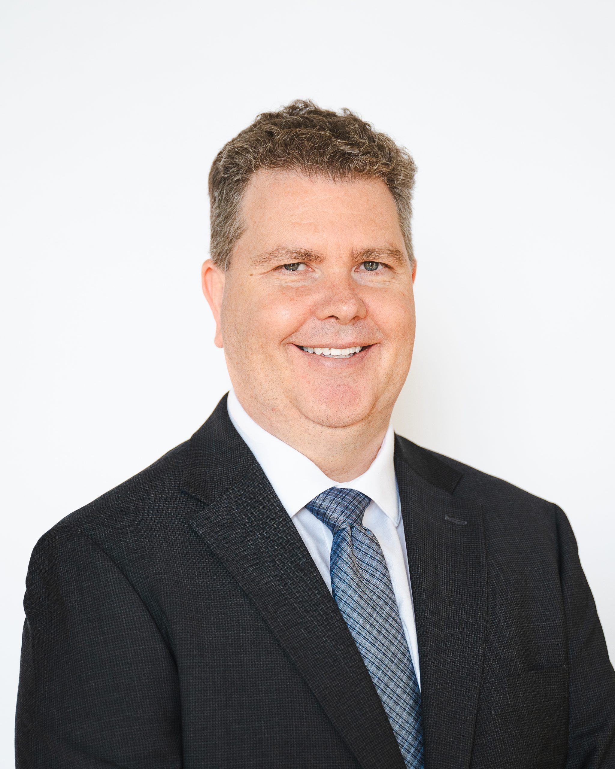 Headshot of Kevin Young on a white background.