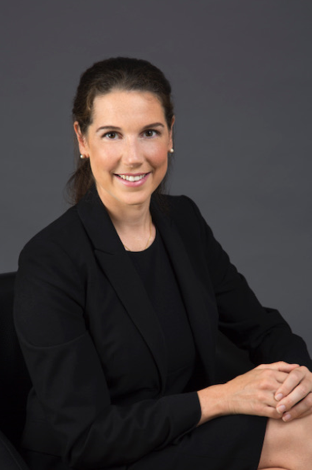 Headshot of Dr. Jennifer Crawford smiling in front of a grey background.