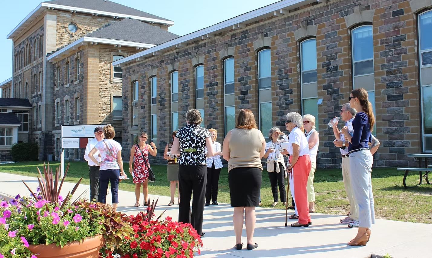 A walking tour group outside of Waypoint.